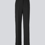Gale pants in Black have a classic design. The pants have straight, wide legs with pressfolds, which creates an elegant look. Buy Gale Blazer or GaleMD straight blazer in the same color that fits the pants. These pants have a spacious fit. We recommend sizing down.