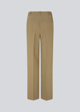 Gale pants in the color Dune have a classic design. The pants have straight, wide legs with press folds, which creates an elegant look. The model is 177 cm and wears a size S/36.  Style the pants with a matching blazer in the same color: Gale blazer.