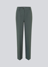 Gale pants has a classic design. The pants has straight, wide legs with pressfolds, which creates an elegant look. The model is 175 cm and wears a size S/36.