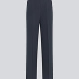 Gale pants in midnight blue have a classic design. The pants have straight, wide legs with press folds, which creates an elegant look. The model is 177 cm and wears a size S/36.  Style the pants with matching blazer in the same color: Gale blazer.