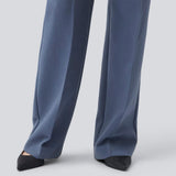Gale pants has a classic design. The pants has straight, wide legs with pressfolds, which creates an elegant look. The model is 175 cm and wears a size S/36.