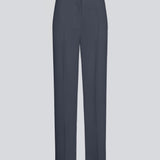 Gale pants has a classic design. The pants has straight, wide legs with pressfolds, which creates an elegant look. The model is 175 cm and wears a size S/36.