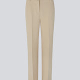 Gale pants in Powder Sand have a classic design. The pants have straight, wide legs with pressfolds, which creates an elegant look.