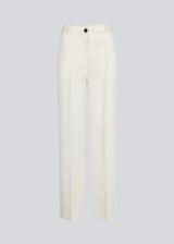 Gale pants in white have a classic design. The pants have straight, wide legs with pressfolds, which creates an elegant look. The model is 175 cm and wears a size S/36.  Style with matching blazer: Gale blazer in white.