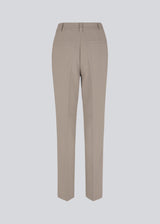 Gale pants have a classic design. The pants have straight, wide legs with press folds, which creates an elegant look. These pants have a spacious fit. We recommend sizing down.