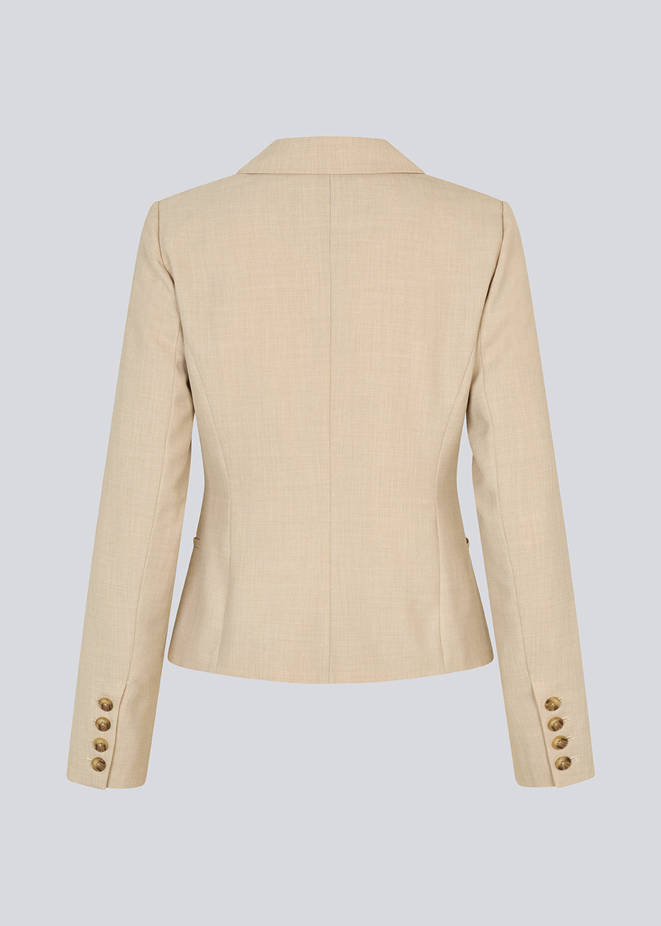 GaleMD 2 short blazer features the classic Gale design but in a lighter quality. The blazer is fitted, slightly cropped, and has a button closure and two pockets in front. The blazer is light cream.