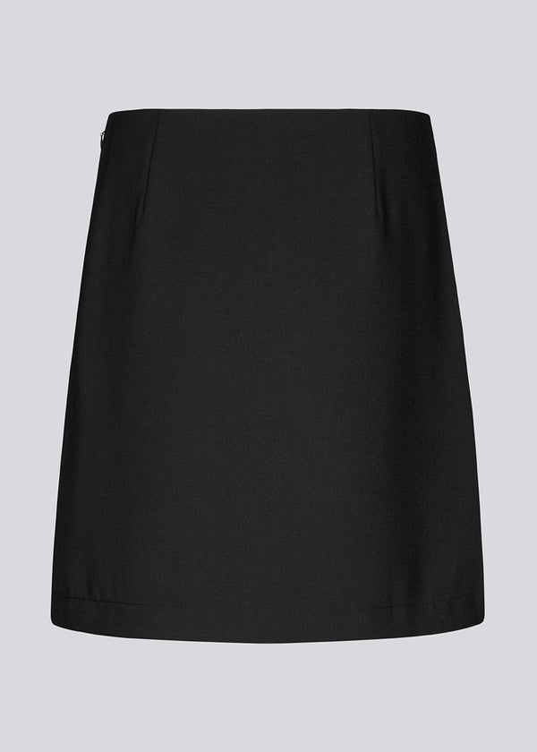 Classic black A-line skirt with a short length. GaleMD 2 skirt has a simple design with a hidden zipper at the side seam and a slit in front.&nbsp;  The skirt is bigger than our regular GaleMD skirt.