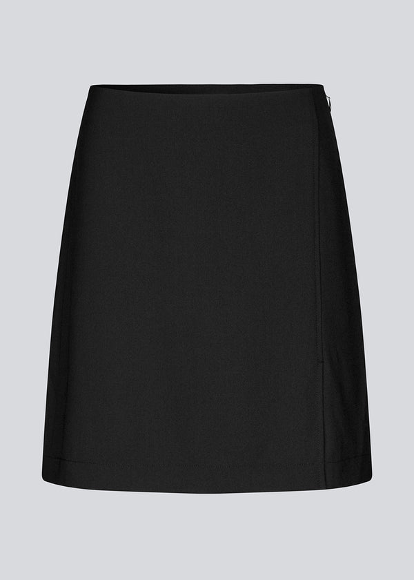 Classic black A-line skirt with a short length. GaleMD 2 skirt has a simple design with a hidden zipper at the side seam and a slit in front.&nbsp;  The skirt is bigger than our regular GaleMD skirt.