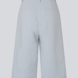 Long tailored shorts with pleats in classic Gale fabric. The GaleMD Long Shorts feature wide legs, side pockets, and fall just below the knee. Made from 76% recycled polyester, perfect for modern and stylish summer looks.