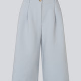 Long tailored shorts with pleats in classic Gale fabric. The GaleMD Long Shorts feature wide legs, side pockets, and fall just below the knee. Made from 76% recycled polyester, perfect for modern and stylish summer looks.