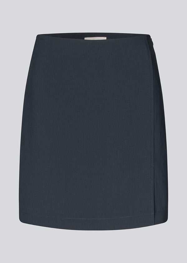 Classic A-line skirt in dark blue in short length. GaleMD skirt has a simple expression with a hidden zip at side seam and slit in front.