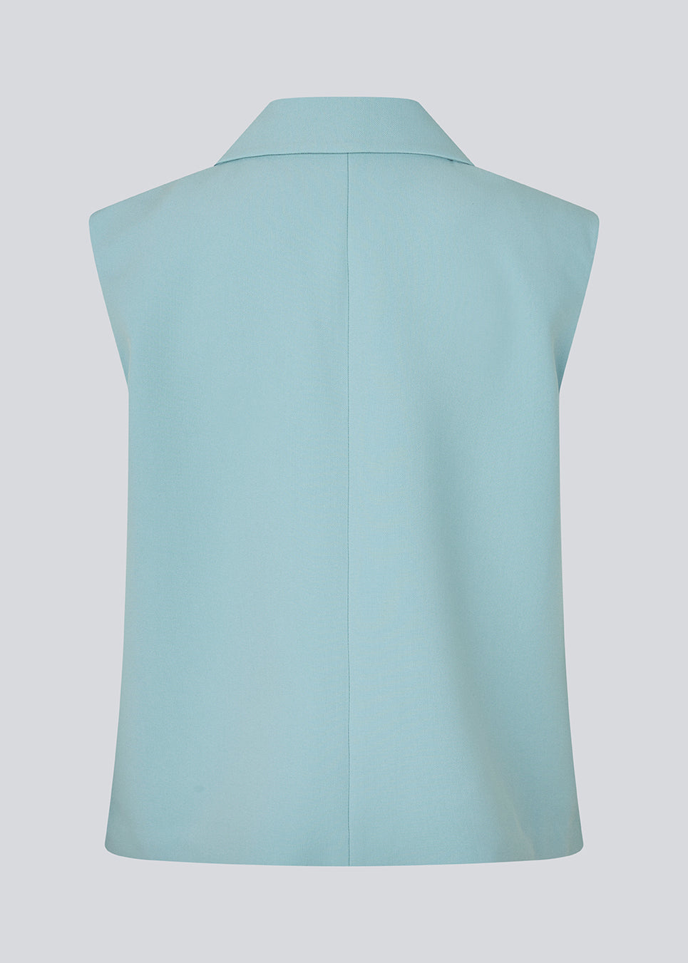 Loose blue vest with a collar in our classic gale material. Galemd vest is sleeveless and has a front button closure. 