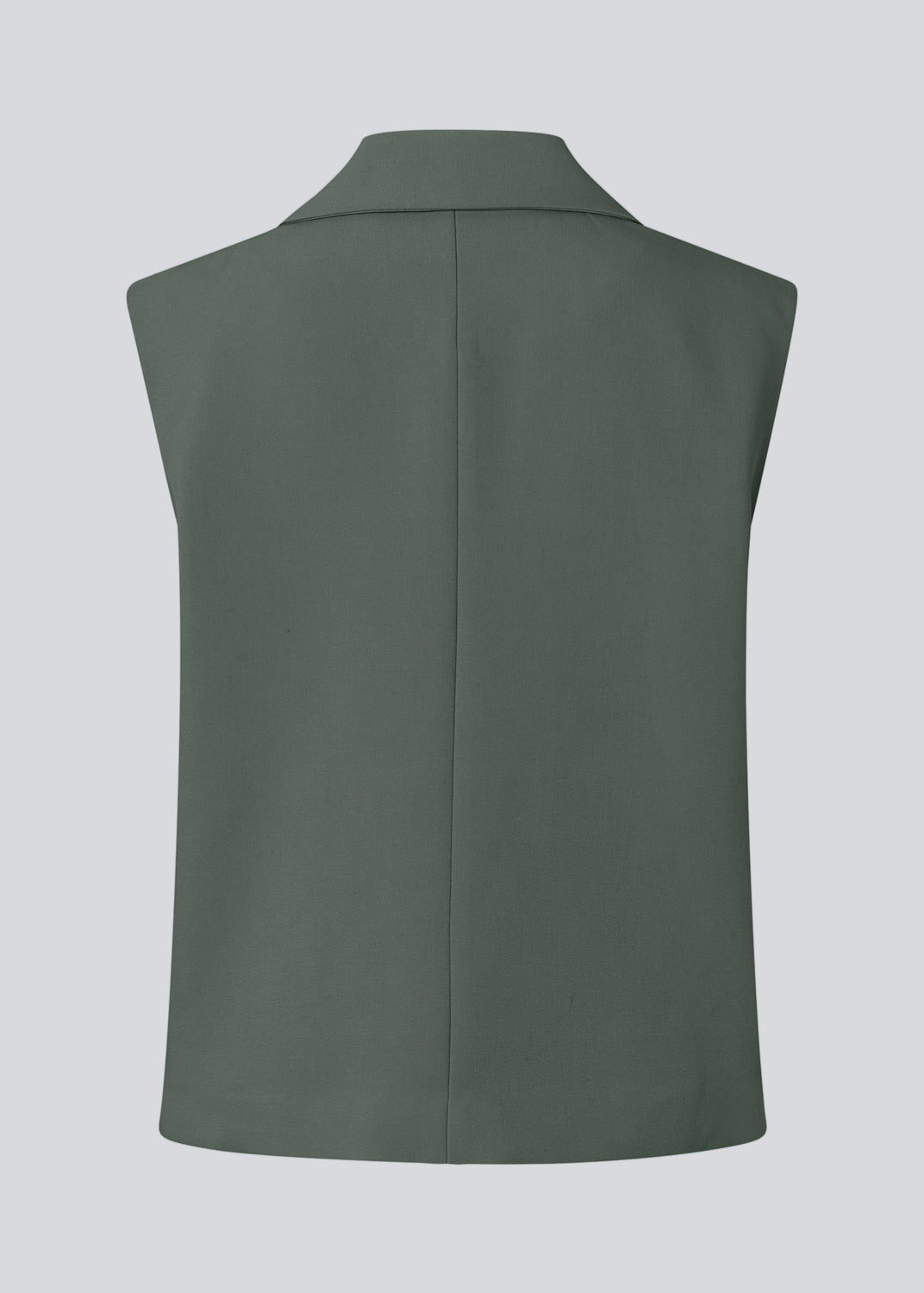 Loose vest in dark green with a collar in our classic gale material. Galemd vest is sleeveless and has a front button closure.&nbsp;