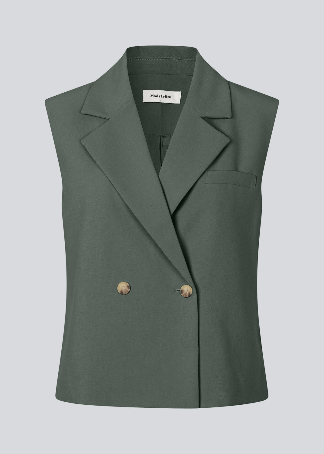 Loose vest in dark green with a collar in our classic gale material. Galemd vest is sleeveless and has a front button closure.&nbsp;