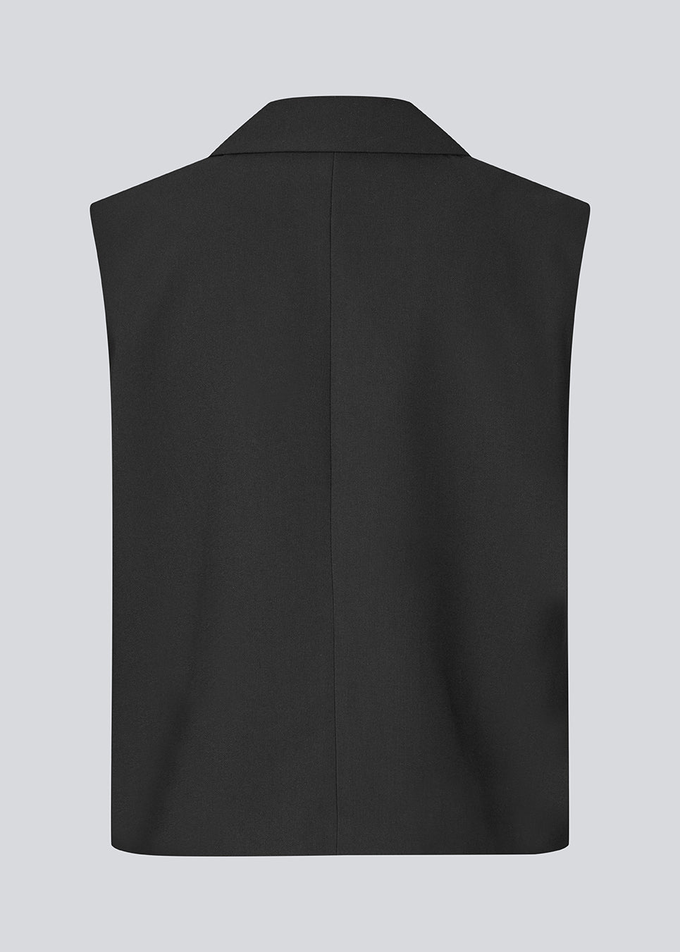 Loose vest with a collar in our classic gale material. Galemd vest is sleeveless and has a front button closure. The model is 175 cm and wears a size S/36.