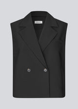 Loose vest with a collar in our classic gale material. Galemd vest is sleeveless and has a front button closure. The model is 175 cm and wears a size S/36.
