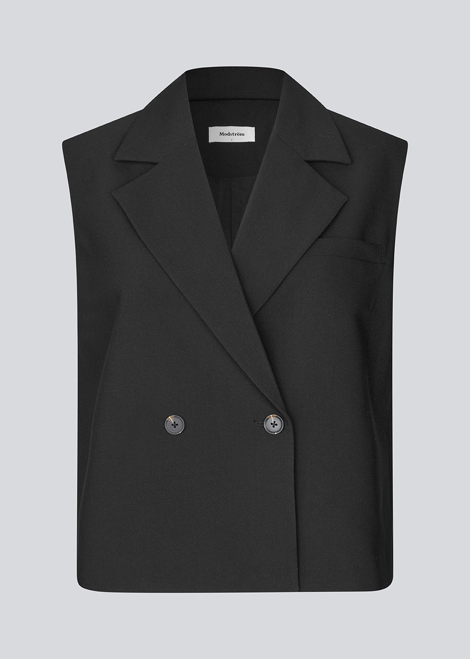 Loose vest with a collar in our classic gale material. Galemd vest is sleeveless and has a front button closure. The model is 175 cm and wears a size S/36.