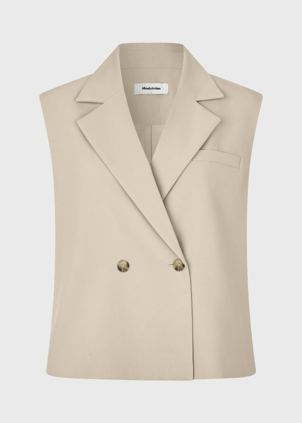 Loose vest with a collar in our classic gale material. Galemd vest is sleeveless and has a front button closure