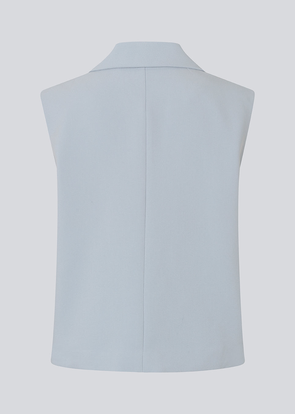 Loose vest with a collar in our classic gale material. Galemd vest is sleeveless and has a front button closure. 