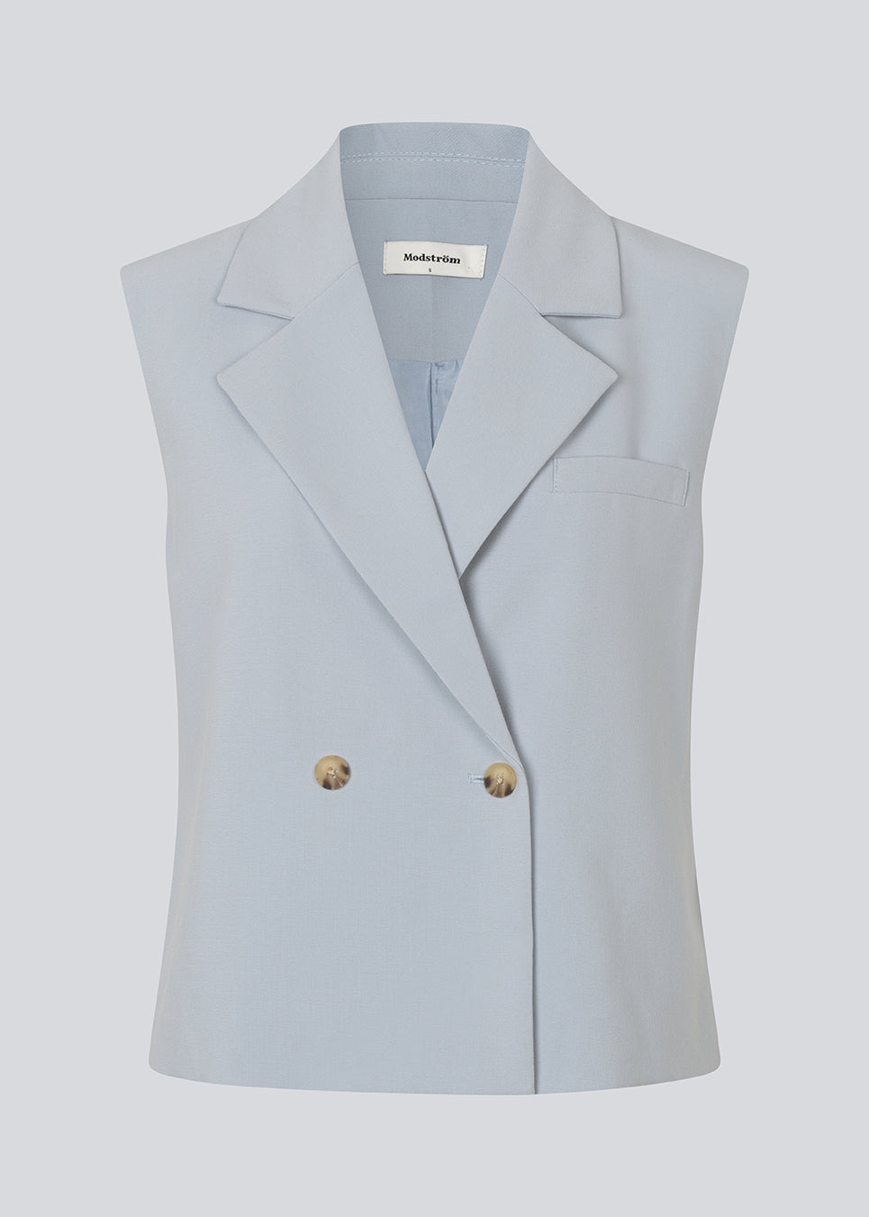 Loose vest with a collar in our classic gale material. Galemd vest is sleeveless and has a front button closure. 