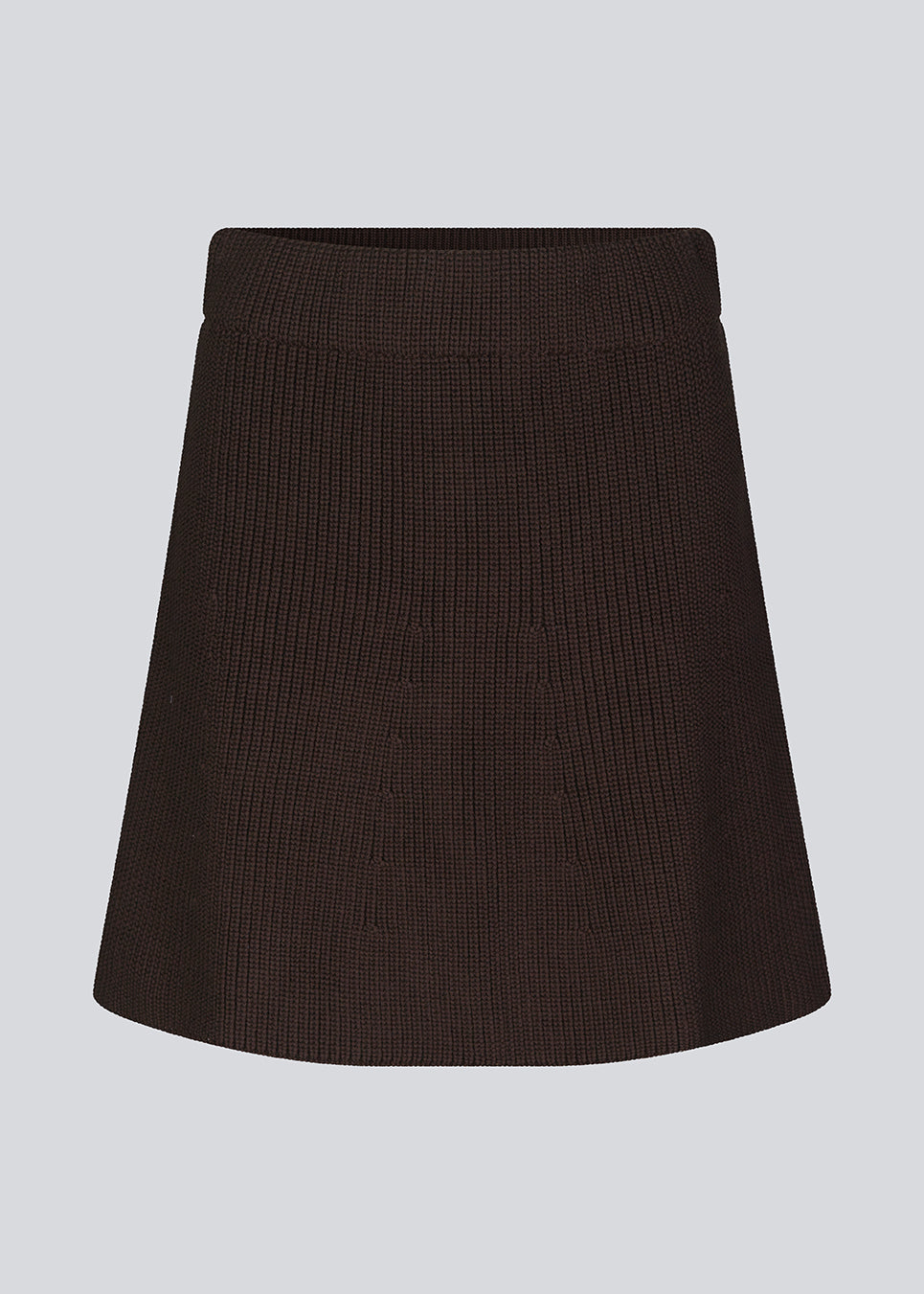 Knitted mini skirt in an A-line silhouette with a high waist with covered elasticated. GalenMD skirt is made of organic cotton. The model is 175 cm and wears a size S/36.