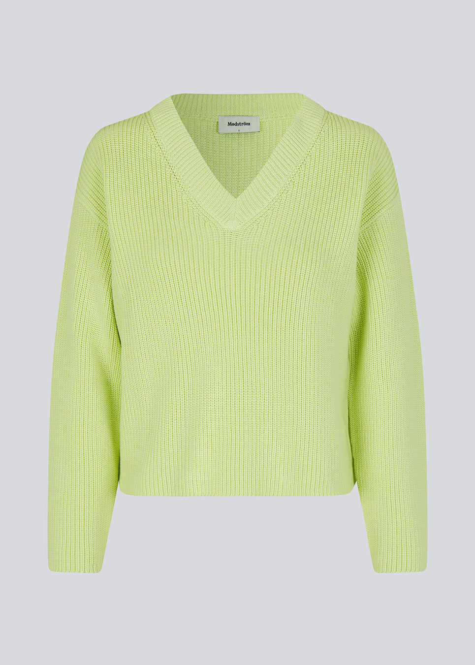 GalenMD v-neck in bright greenis knitted from an organic cotton with an oversize fit, long wide sleeves, a v-neck, and dropped shoulders. The model is 175 cm and wears a size S/36.<br>