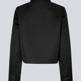 Cropped double-breasted blazer in a heavy satin. GavinMD blazer has a collar and lapels, fabric covered buttons in front and slits at cuffs. The model is 175 cm and wears a size S/36