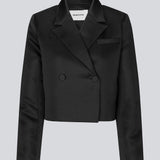 Cropped double-breasted blazer in a heavy satin. GavinMD blazer has a collar and lapels, fabric covered buttons in front and slits at cuffs. The model is 175 cm and wears a size S/36