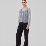 Top with relaxed fit and slightly shorter body covered in sequins. GerardMD top has long sleeves, a round neckline and split back with button closure. The model is 175 cm and wears a size S/36.