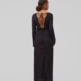 Long sleeved dress in jacquard satin. GraceyMD dress is designed with a relaxed fit and a deep opening in the back with lacing and narrow ties. Slit at center back. The model is 175 cm and wears a size S/36.