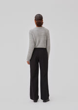 Fluffy cropped top with a round neckline and long raglan sleeves. GriseldaMD o-neck has narrow ribbed trims at neck, sleeves and hem. The model is 175 cm and wears a size S/36.