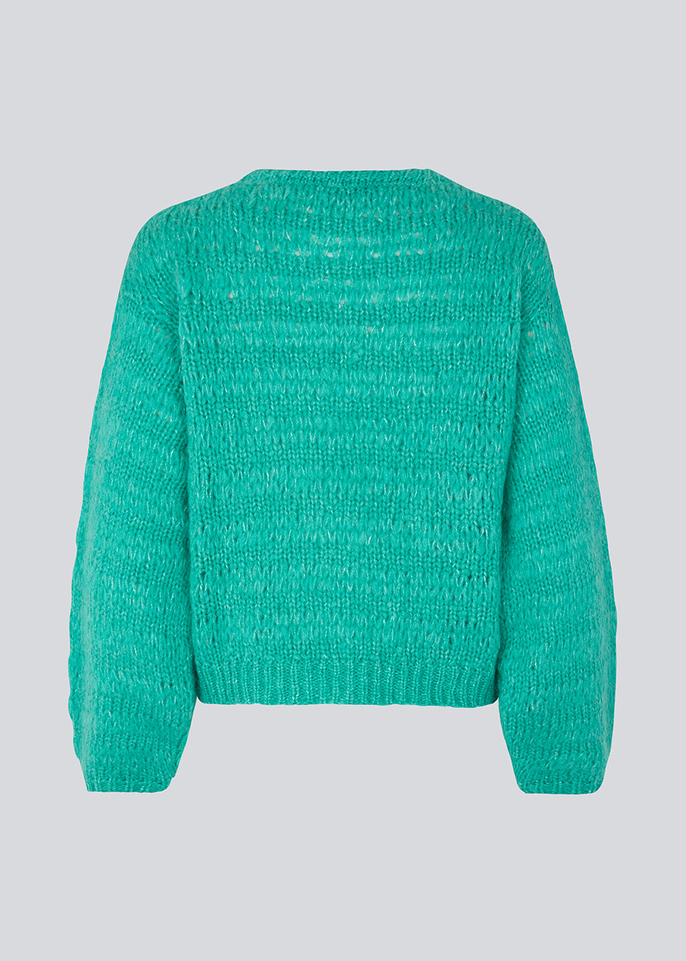 Woolen jumper in green with long stitches for a relaxed look. GroverMD o-neck has long sleeves with volume, a round neck with ribbed details. Contains wool and alpaca. 