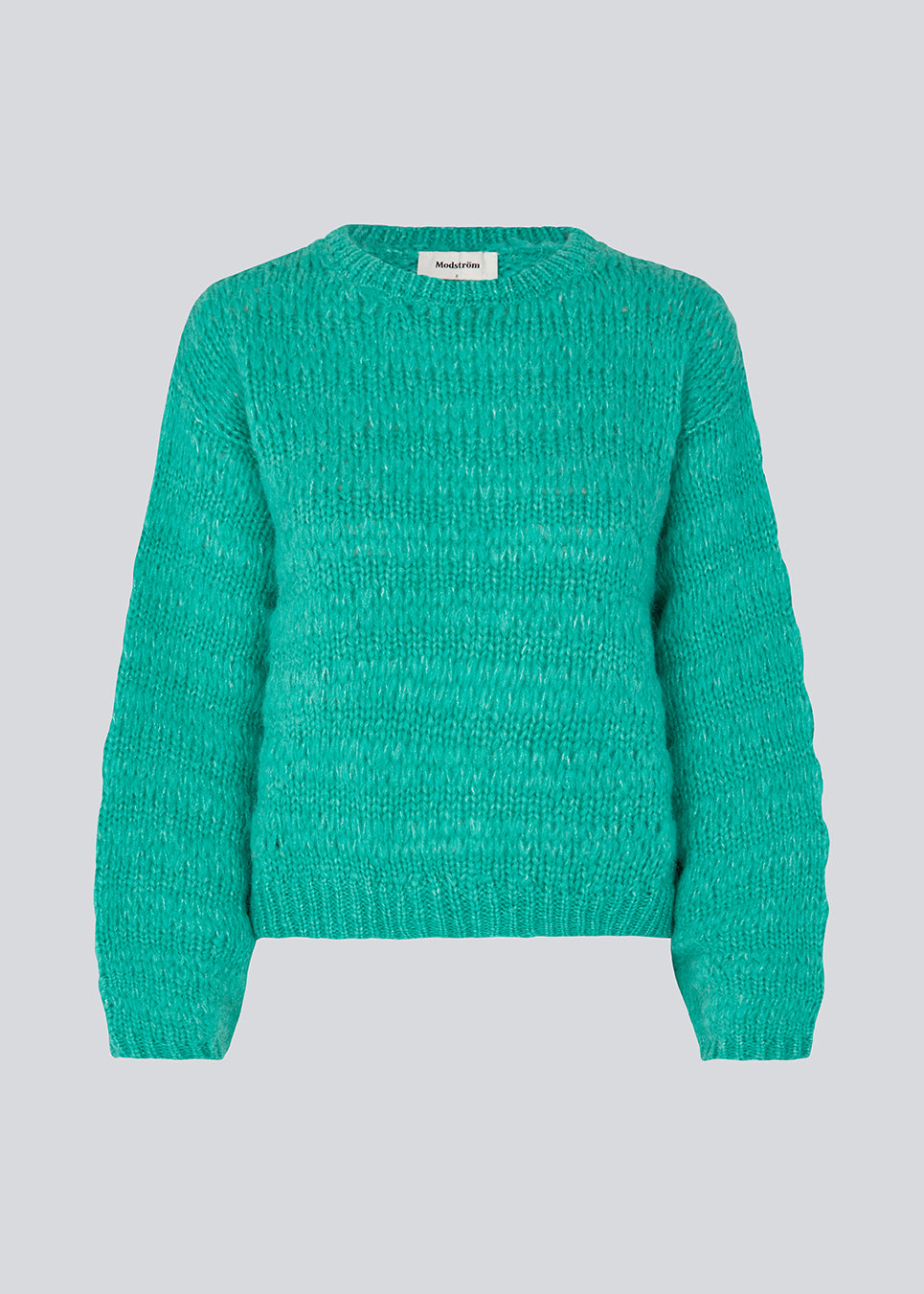 Woolen jumper in green with long stitches for a relaxed look. GroverMD o-neck has long sleeves with volume, a round neck with ribbed details. Contains wool and alpaca. 