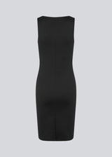 Figure-hugging dress in black with a high boat neck. HakanMD dress is sleeveless, and a midi length cutting at the knees.<br>