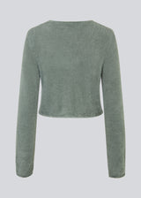 Cropped cardigan in soft green made from a fluffy material. HamptonMD cardigan has long sleeves, v-shaped neckline, and is closed with two buttons in front. 
