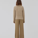 Knitted jumper made from a wool and alpaca blend. HardwickMD polo has a loose fit with collar and buttons in front, dropped shoulders, and long sleeves with a smaller, ribbed cuff. The model is 175 cm and wears a size S/36.