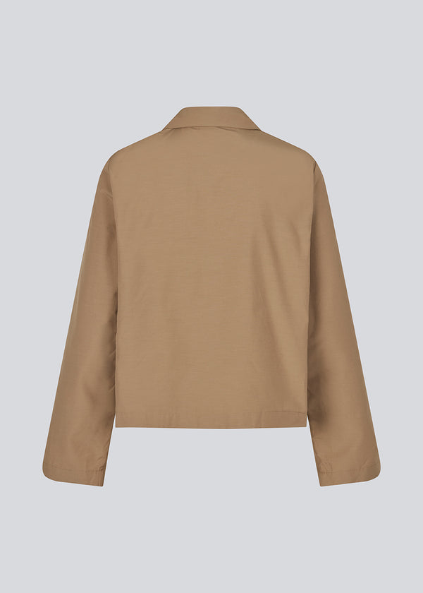 Shirt in brown made from a crisp cotton blend with a casual fit. HarmonieMD shirt has a resort collar, two tiebands in front, and long wide sleeves.&nbsp;