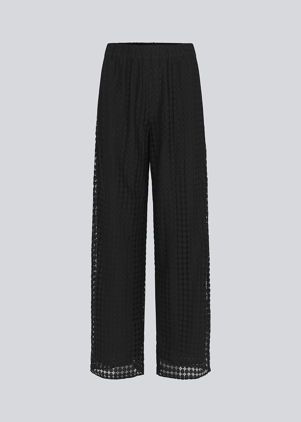 HattieMD pants in black are made from a transparent lace material. The pants have a loose fit with straight legs and a medium elasticated waist. Lined. The model is 175 cm and wears a size S/36.