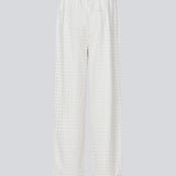 HattieMD pants in white are made from a transparent lace material. The pants have a loose fit with straight legs and a medium elasticated waist. Lined. The model is 175 cm and wears a size S/36.