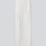 HattieMD pants in white are made from a transparent lace material. The pants have a loose fit with straight legs and a medium elasticated waist. Lined. The model is 175 cm and wears a size S/36.