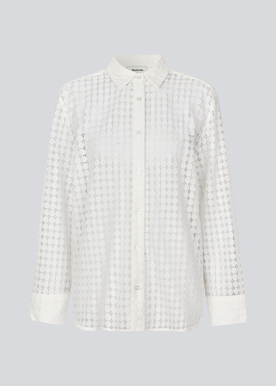 Shirt in white with an easy fit in a transparent lace material. HattieMD shirt has long sleeves with cuff, collar, and button closure in front. The model is 175 cm and wears a size S/36.<br>