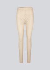 Tights with a snug silhouette in a transparent, patterned quality. HendrickMD tights has a high, elasticated waist. The model is 175 cm and wears a size S/36.