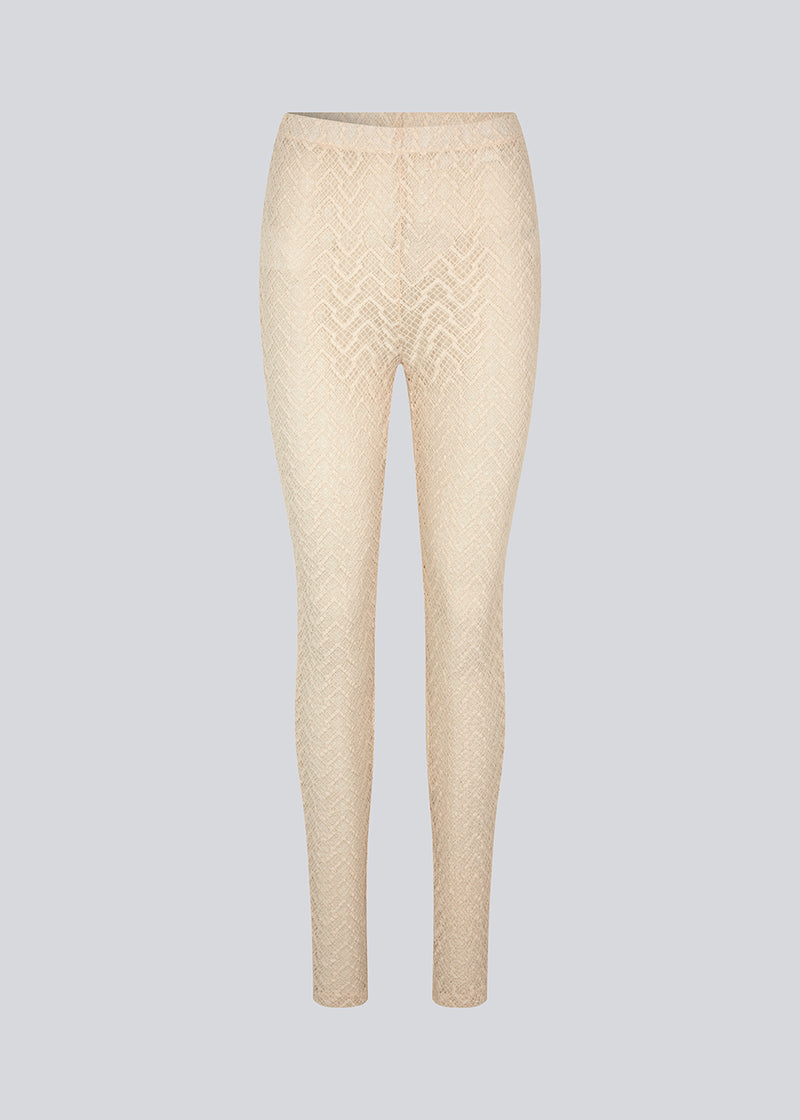 Tights with a snug silhouette in a transparent, patterned quality. HendrickMD tights has a high, elasticated waist. The model is 175 cm and wears a size S/36.