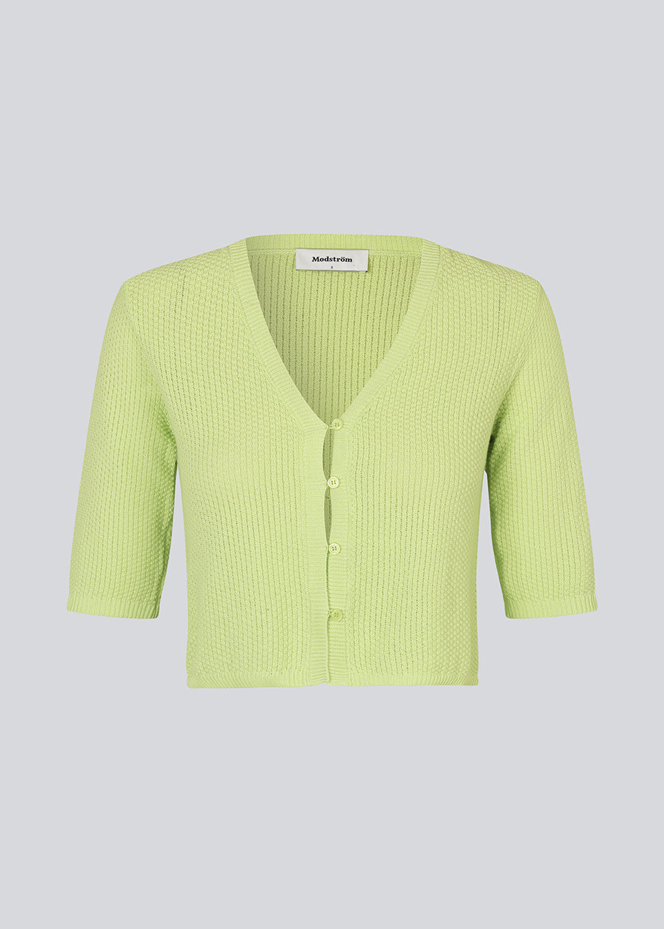 Short cardigan in bright in a structured cotton blend with ribbed trimmings. HeroMD cardigan has a v-neck with button closure in front and short sleeves.