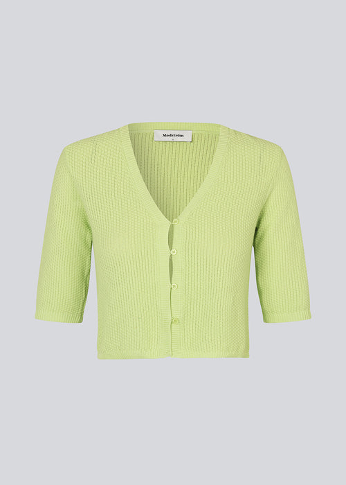 Short cardigan in bright in a structured cotton blend with ribbed trimmings. HeroMD cardigan has a v-neck with button closure in front and short sleeves.