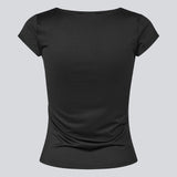 Fitted black T-shirt with draping. The Himamd Drapy T-shirt is made from 95% recycled polyester and features an elastic fit. The sophisticated draping adds a feminine and modern twist, perfect for both everyday and evening looks.&nbsp;