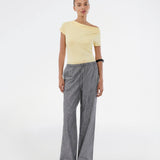 Fitted yellow T-shirt with draping. The Himamd Drapy T-shirt is made from 95% recycled polyester and features an elastic fit. The sophisticated draping adds a feminine and modern twist, perfect for both everyday and evening looks.&nbsp;
