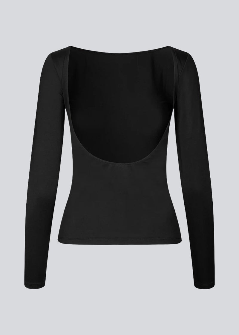 Black top with long sleeves made of elastic material. HimaMD LS top is fitted and has a deep back neckline.