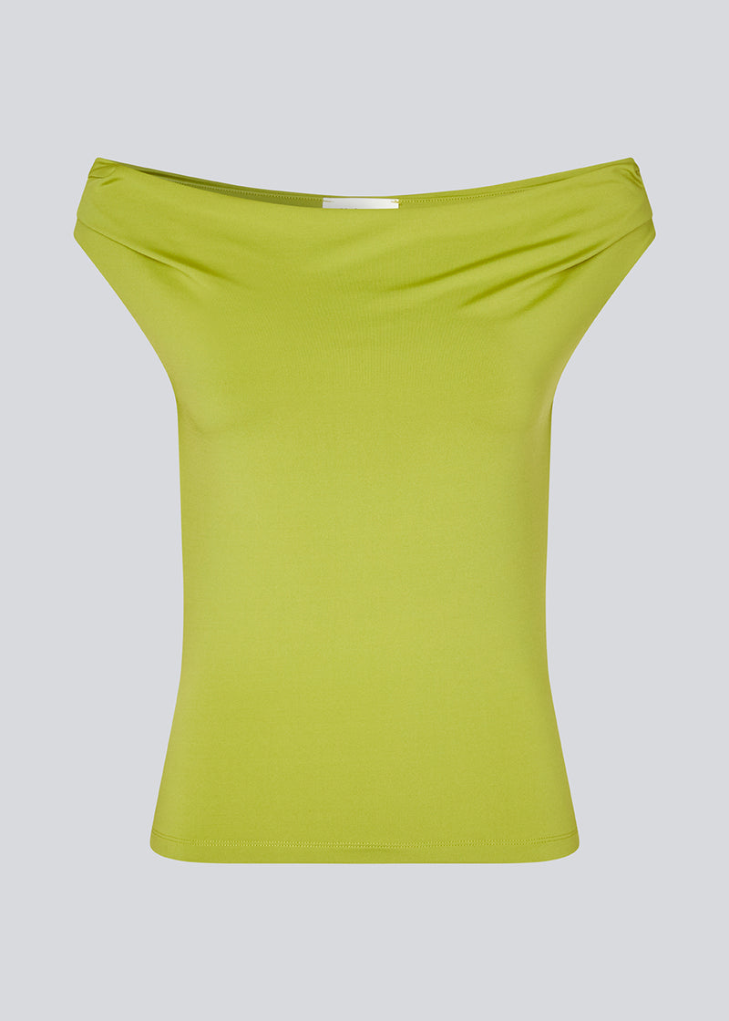 Off-shoulder top in lime green in a stretchy material. HimaMD off-shoulder top is fitted and slightly cropped.