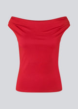 Red off-shoulder top in a stretchy material. HimaMD off-shoulder top is fitted and slightly cropped. The model is 175 cm and wears a size s/36.
